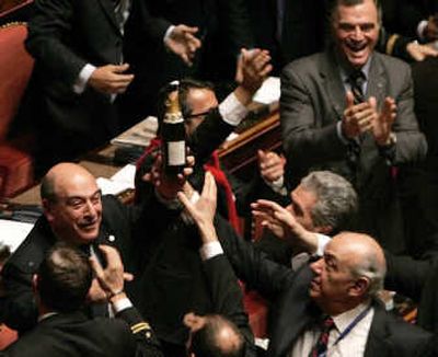 
Italian opposition senators celebrate after a no-confidence vote   Thursday in Rome toppled embattled Premier Romano Prodi. 
 (Associated Press / The Spokesman-Review)