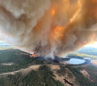 In a photo provided by Alberta Wildfire, smoke rises from a wildfire near Lodgepole, Alberta, on Thursday. Over 100 wildfires were burning across Alberta on Saturday.  (ALBERTA WILDFIRE)