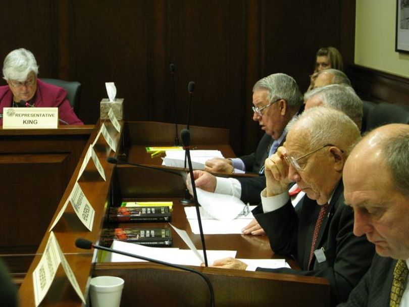 Members of the House State Affairs Committee convene their meeting on Wednesday morning, with a free copy of the book 