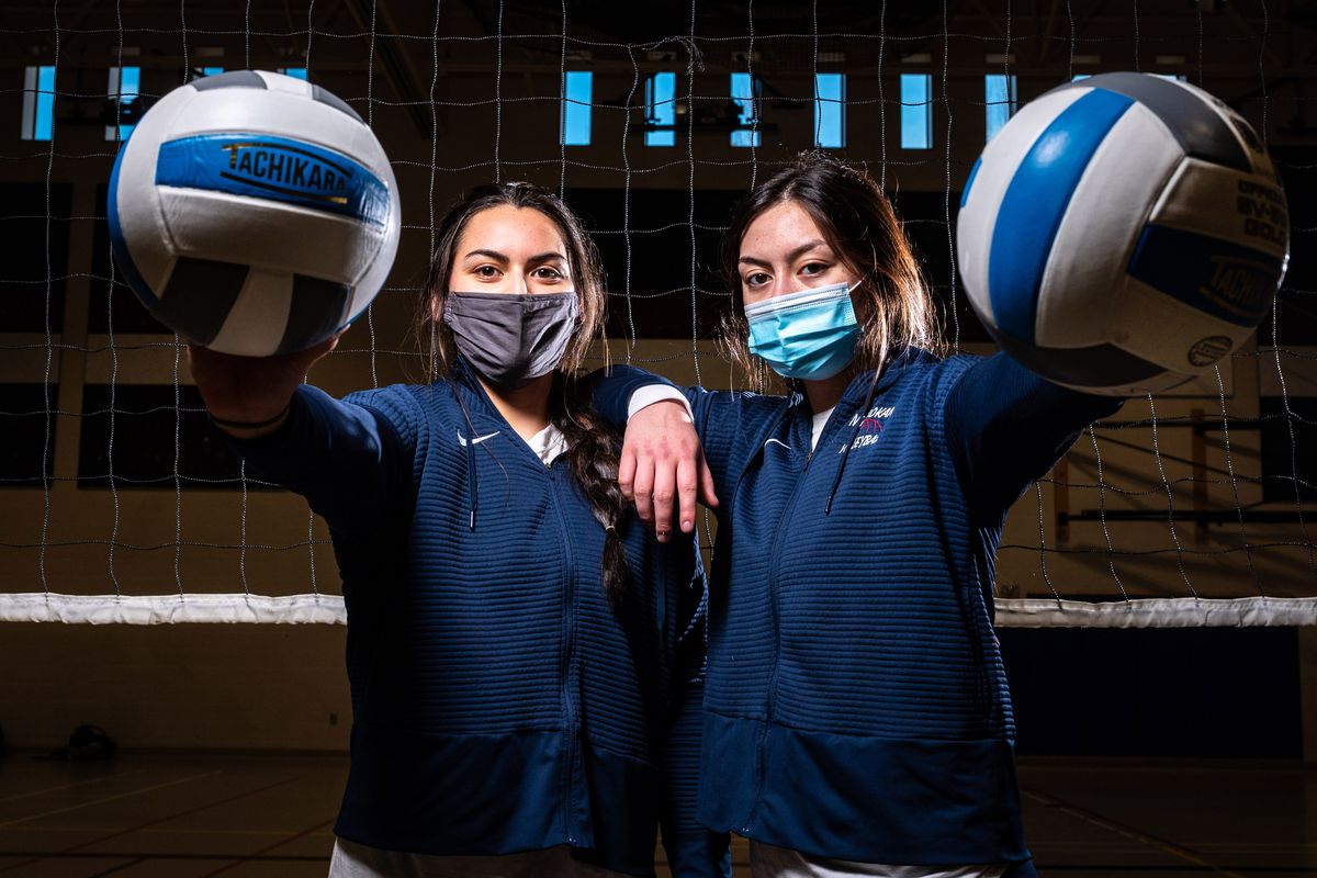 Mt. Spokane’s Allen sisters, junior Teila, left, and senior Tia, pose for a portrait before their Greater Spokane League 4A/3A volleyball sweep against Cheney on Tuesday.  (COLIN MULVANY)