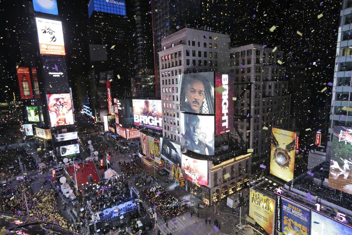 Confetti flies over Times Square during the New Year’s celebration in New York, Sunday, Dec. 31, 2017. New Yorkers, celebrity entertainers and tourists from around the world are packing into a frigid Times Square Sunday to mark the start of 2018 with a glittering crystal ball drop, a burst of more than a ton of confetti and midnight fireworks. (Seth Wenig / Associated Press)