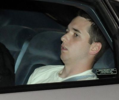 Raymond Clark III, 24, is driven away from an apartment building by police on Tuesday. Hartford Courant (John Woike Hartford Courant / The Spokesman-Review)