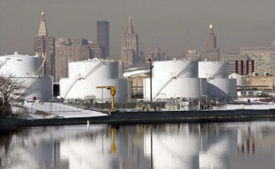 
BP oil tanks along Newtown  Creek in the Greenpoint section of Brooklyn are visible against the New York City skyline this month. Area residents have filed a lawsuit against oil company giants Exxon, Chevron and BP to clean up what is left of an estimated 17-million-barrel underground oil spill. 
 (Associated Press / The Spokesman-Review)