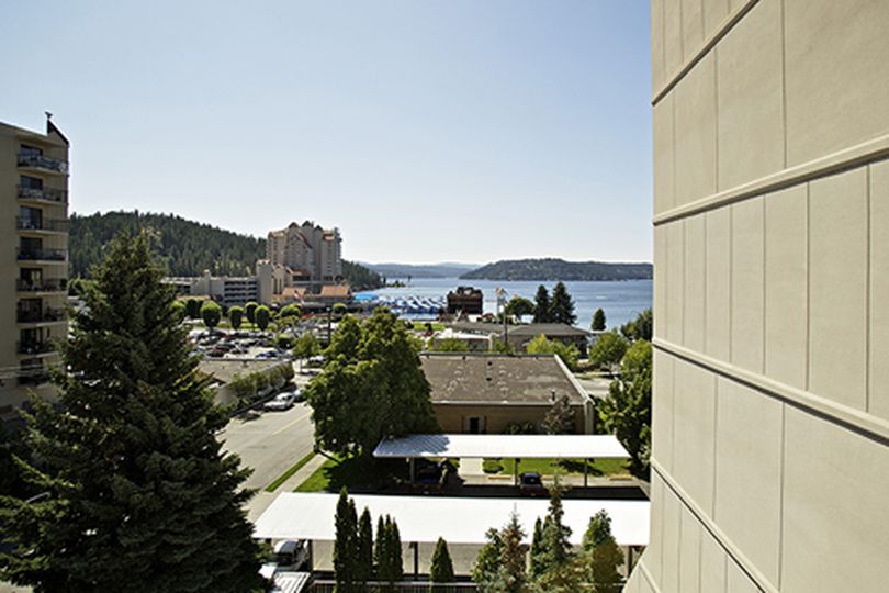 Nancy Ladyman's view of Lake Coeur d'Alene and Tubbs Hill from her seventh-floor condo will be blocked if a high-rise building at the corner of First Street and Lakeside Avenue is built. (Jerome Pollos/press)