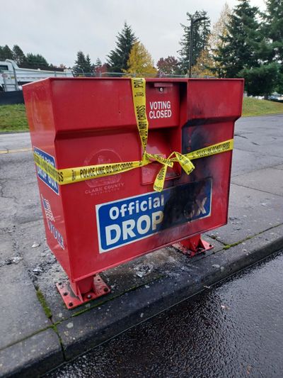 The ballot drop box at Fisher’s Landing in Vancouver, Wash., was damaged by an incendiary device Monday morning.  (Monika Spykerman/Columbian)