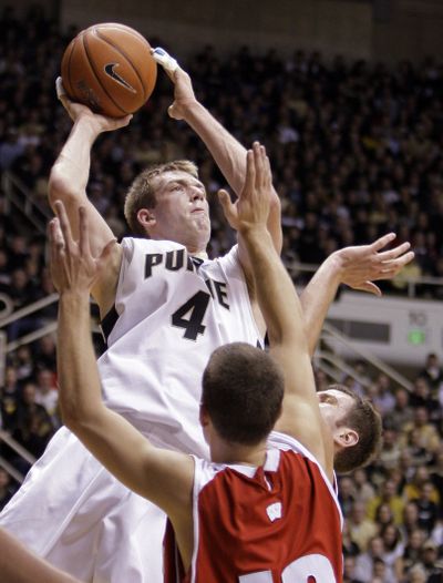Purdue’s Robbie Hummel shoots over Wisconsin’s Jason Bohannon in the second half of the Boilermakers’ win Thursday.  (Associated Press)