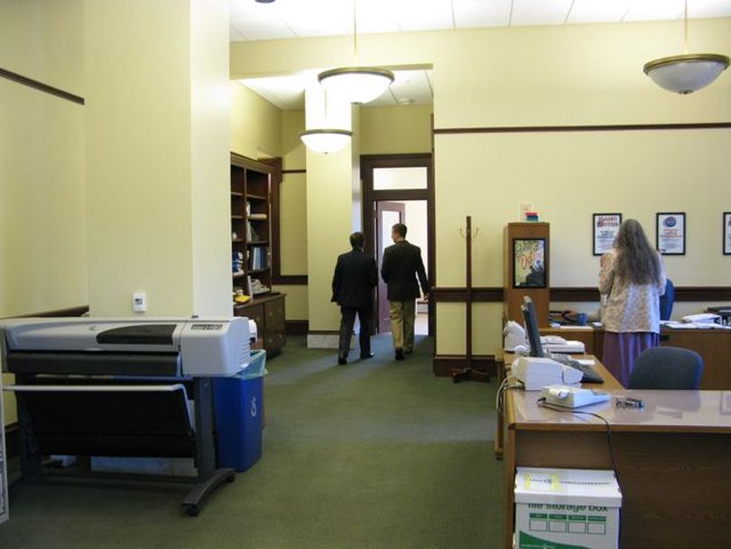 Idaho Republican Party Chairman Norm Semanko and executive director Jonathan Parker head into a meeting room at the Secretary of State's office on Monday morning to talk about redistricting. (Betsy Russell)