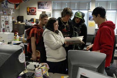 
Amaryssa Byers shares with her University Alernative Center classmates her book that she kept after an accident that almost killed her before her freshman year. She spent more than a week in a coma and now is getting ready to graduate from University High School on time this spring. 
 (J. BART RAYNIAK / The Spokesman-Review)