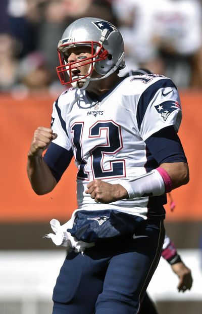 New England Patriots quarterback Tom Brady celebrates a touchdown in the first half of Sunday’s game against the host Cleveland Browns. (David Richard / Associated Press)