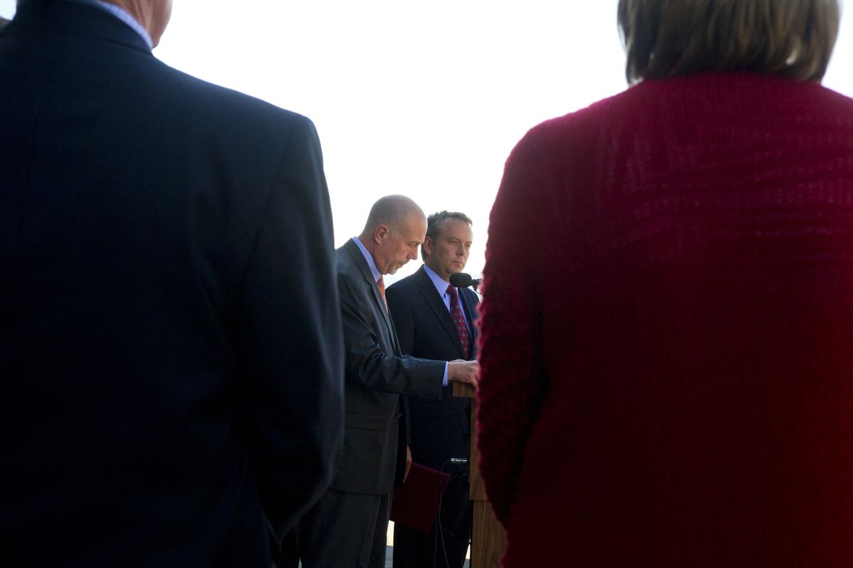 Spokane Mayor David Condon looks on as Frank Straub, the newly announced Spokane police chief, reads a statement on Wednesday during a press conference at Spokane City Hall. (Tyler Tjomsland)