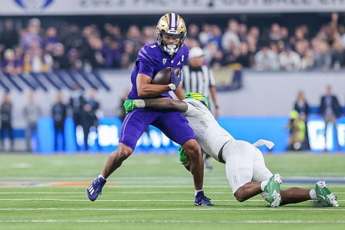 An Oregon defender tries to tackle Washington receiver Rome Odunze during the Pac-12 championship game Dec. 1 at Allegiant Stadium in Las Vegas.  (Tribune News Service)