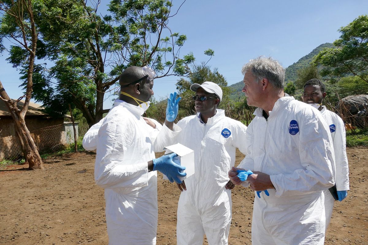 Washington State University’s Kariuki Njenga, center, and Tom Kawula, right, consult with colleagues Arithi Mutembei, left, and Boru Wato, right, as they do field work in Marsabit County in 2018.  (Courtesy of WSU College of Veterinary Medicine)