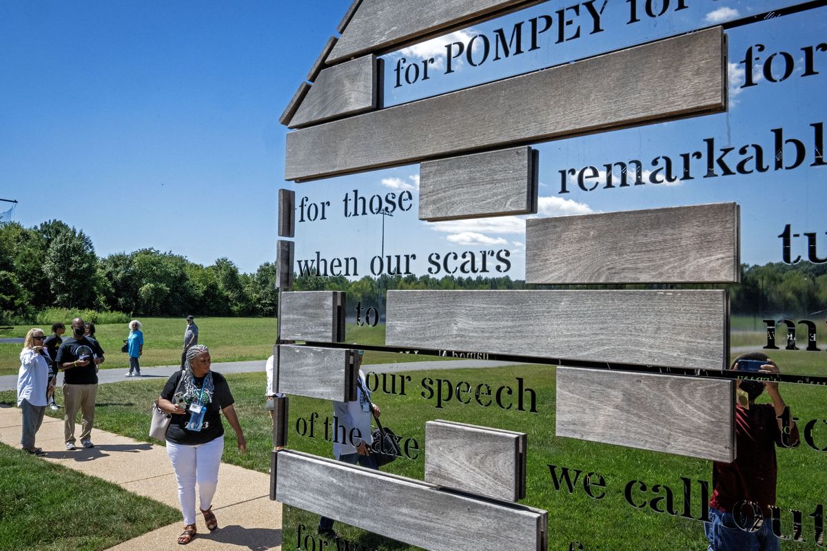 Participants in a reunion for descendants of enslaved Maryland families walk to an art installation dedicated to the formerly enslaved in St. Mary