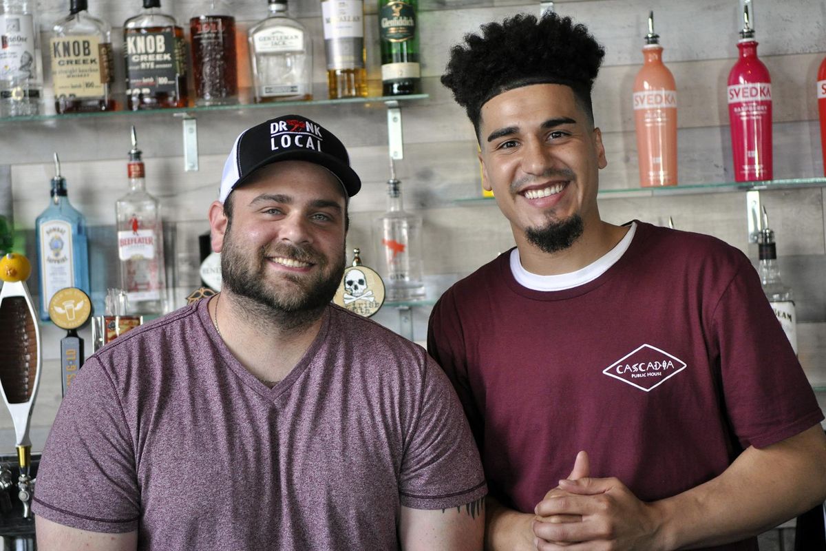 Johnny Oliveri, 30, and Jordan Smith, 27, are two of the five owners of the new Cascadia Public House in North Spokane. (Adriana Janovich / The Spokesman-Review)