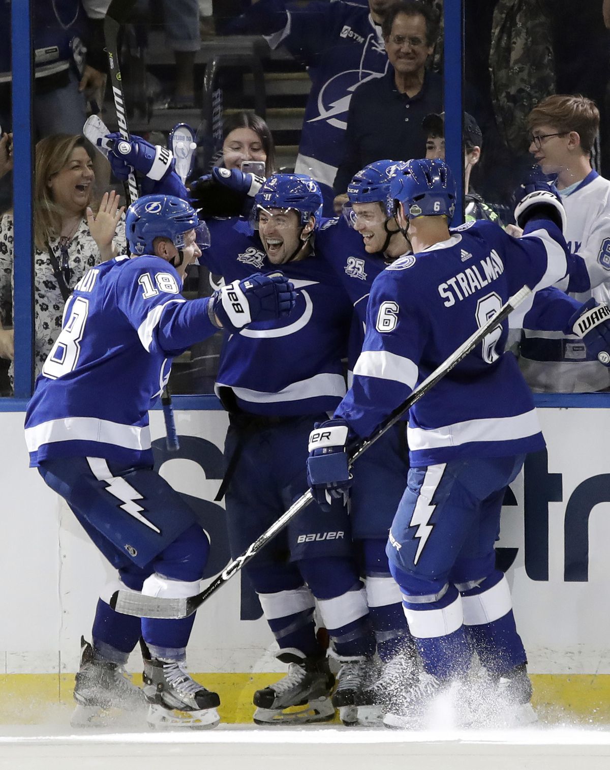 Tampa Bay Lightning center Tyler Johnson (9) celebrates his goal against the New Jersey Devils with left wing Ondrej Palat (18), center Brayden Point (21), and defenseman Anton Stralman (6) during the first period of Game 1 of an NHL first-round hockey playoff series Thursday, April 12, 2018, in Tampa, Fla. (Chris O’Meara / Associated Press)