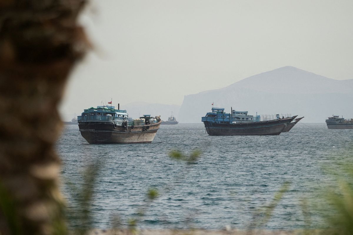 Vessels sail through the Strait of Hormuz on Saturday in Musandam, Oman. (Stringer)