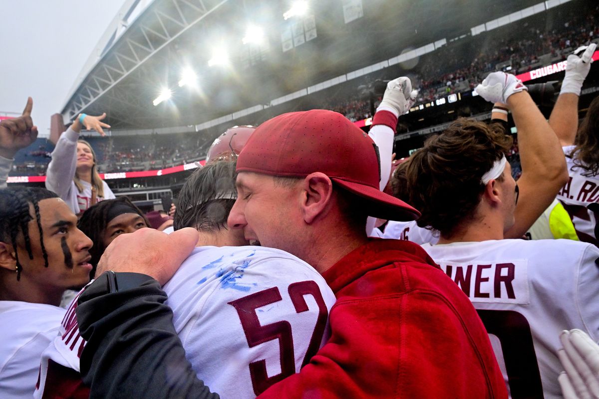 Washington State Cougars head coach Jake Dickert embraces linebacker Kyle Thornton (52) after WSU defeated the Washington Huskies to win the Apple Cup during the second half of a college football game on Saturday, Sep. 14, 2024, at Lumen Field in Seattle, Wash. WSU won the game 24-19.  (Tyler Tjomsland/The Spokesman-Review)