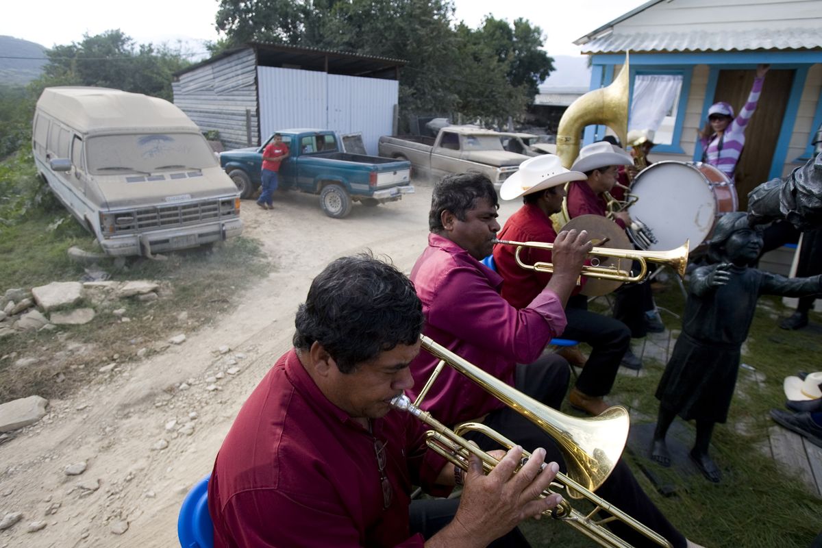 Local musicians play during the  “Paisano Day” truck competition in Jalpan de Serra, Mexico, on Sunday. Migrants parade the  tricked-out “trocas” they got in the U.S.  Associated Press photos (Associated Press photos / The Spokesman-Review)