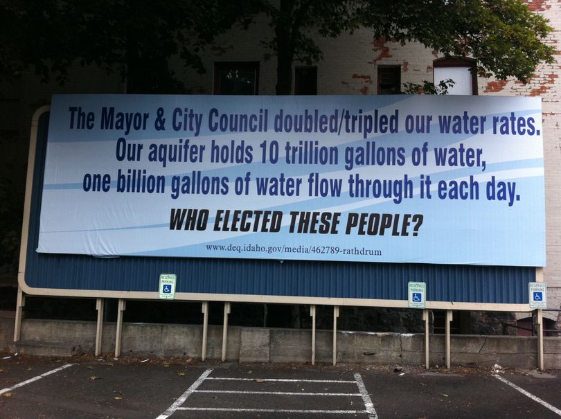 Billboards criticizing recent decisions about water rates in Spokane were erected in a few places recently in the city. This one is on Third Avenue, on top of the former sign for Empire Ford. (Jonathan Brunt)