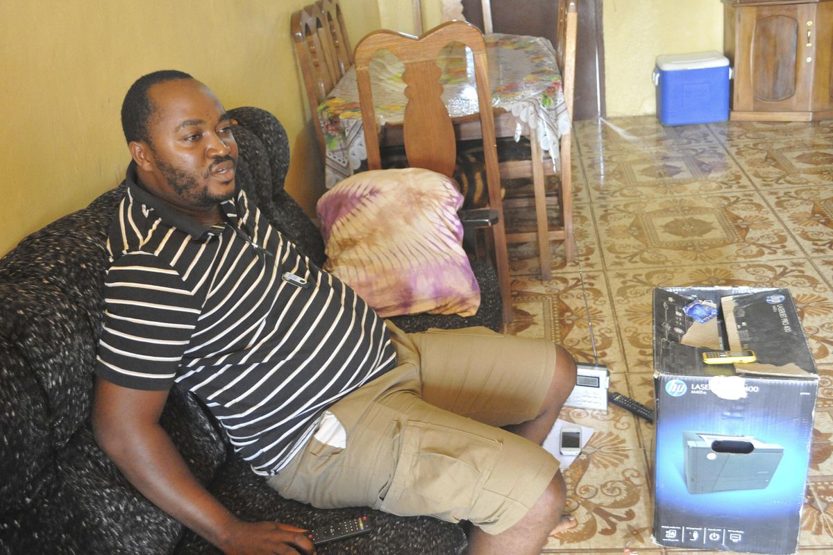 In this photo taken Saturday, April 1, 2017, Patrick Fallah, president of the National Ebola Survivors Network of Liberia, sits inside his house in Monrovia, Liberia. The trauma of the world’s deadliest Ebola outbreak, which killed more than 11,300, has left many survivors fighting a mental health battle to focus on the present, after witnessing drawn-out deaths and whole communities torn apart. (Abbas Dulleh / Associated Press)