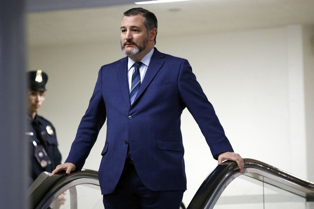 In this Jan. 29, 2020, photo, Sen. Ted Cruz, R-Texas, rides an escalator before speaking with reporters on Capitol Hill in Washington. Cruz voted to overturn the election results.  (Patrick Semansky/Associated Press)