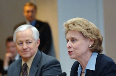 
Gov. Chris Gregoire has brokered a deal on medical malpractice reform. At left is state Insurance Commis- sioner Mike Kreidler. 
 (Richard Roesler / The Spokesman-Review)