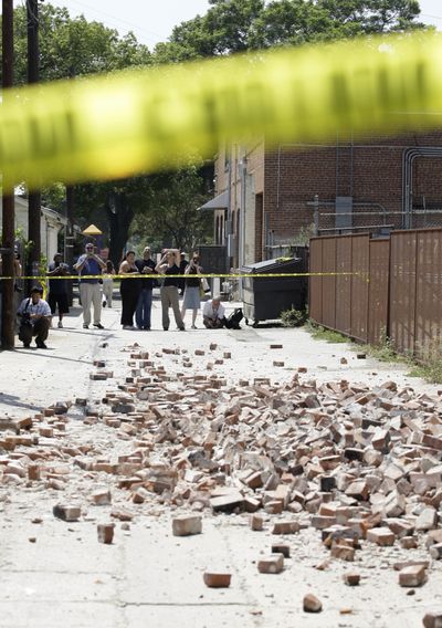 Bricks fell from a vacant building in Pomona, Calif., during an earthquake Tuesday.  (Associated Press / The Spokesman-Review)