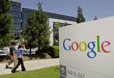 
Two people walk past the Google Inc. headquarters in Mountain View, Calif., on Monday.
 (Associated Press / The Spokesman-Review)