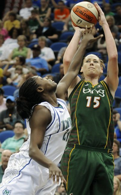 Seattle’s Lauren Jackson shoots over Minnesota’s Nicky Anosike on her way to 26 points during the Storm’s ninth straight victory. (Associated Press)