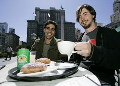 
Jeremy Stoppelman, left, and Russel Simmons,  co-founders of Yelp.com, try the food at a cafe  in San Francisco's Union Square.Associated Press
 (Associated Press / The Spokesman-Review)