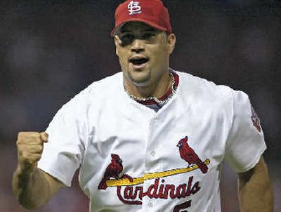 
St. Louis'  Albert Pujols pumps his fist in celebration. 
 (Associated Press / The Spokesman-Review)