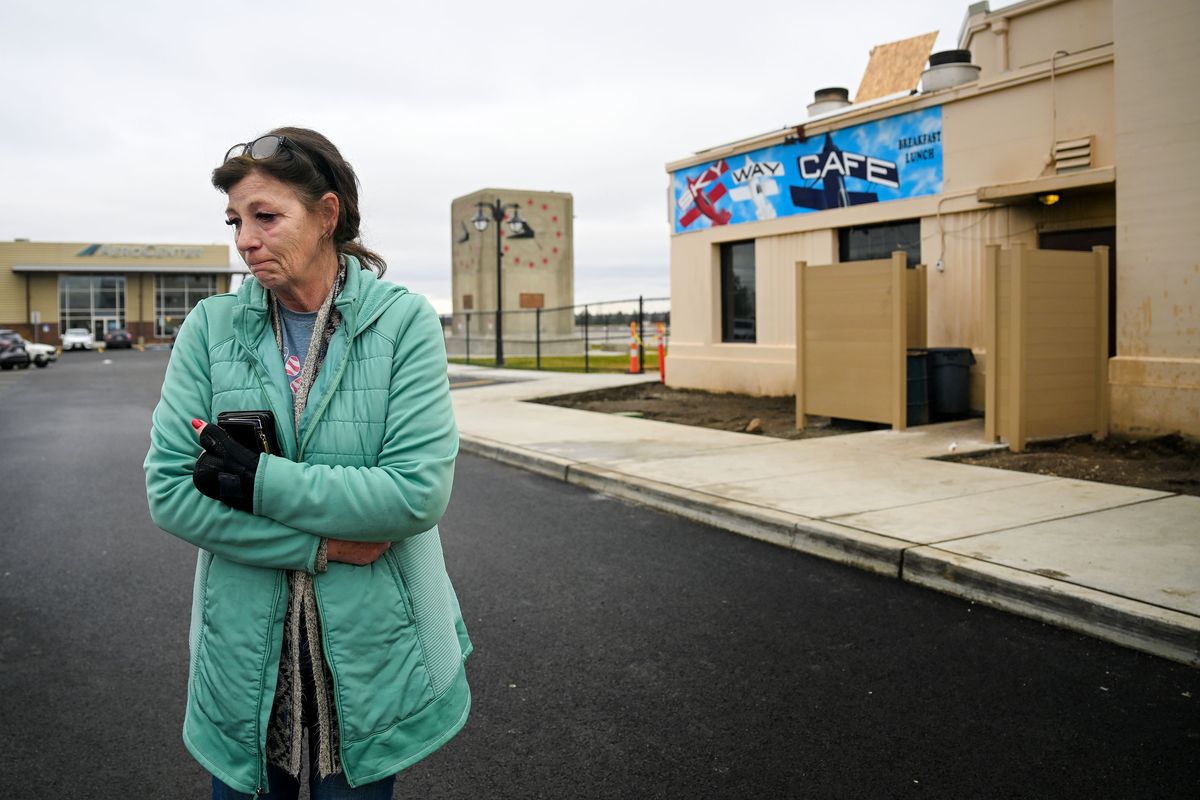 Sandra Melter, owner of Skyway Cafe at Felts Field, expresses her dismay after a fire at the popular restaurant Thursday in Spokane.  (Kathy Plonka/The Spokesman-Review)