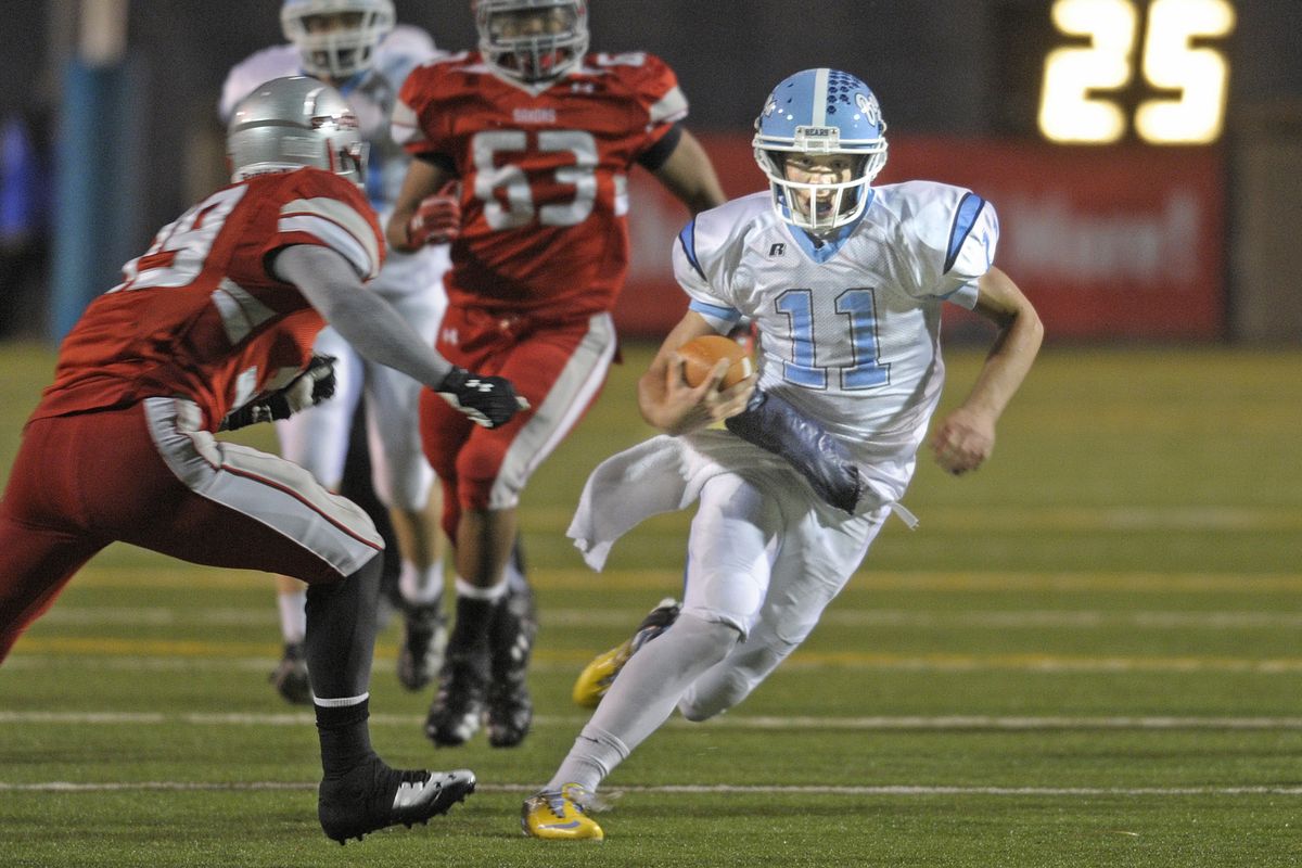 Central Valley quarterback Gaven Deyarmin breaks into the open against Ferris for a long gain. Deyarmin finished with 91 yards rushing. (Christopher Anderson)
