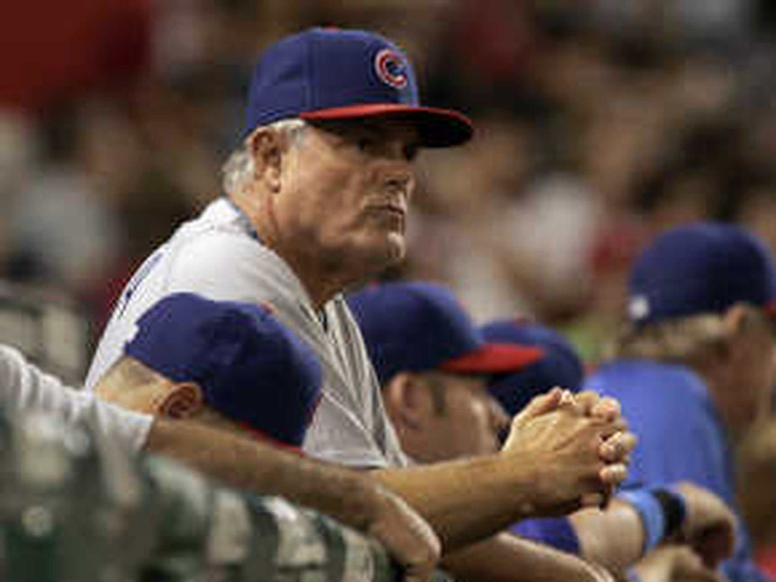 Chicago Cubs manager Lou Piniella walks the dugout during the