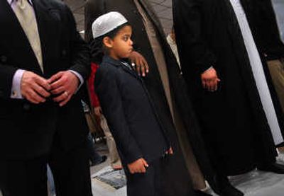 
Hakim Latif, 4, prepares to join his father and other Muslims in prayer in Spokane on Wednesday, the day Muslims mark the Feast of Sacrifice, or Eid al-Adha. 
 (Brian Plonka / The Spokesman-Review)