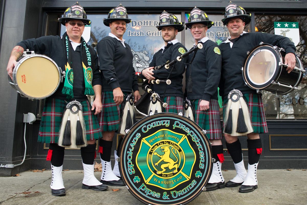 From left, Chris Wetherell, Tom Hatley, Danny Scott, Scott Tschirgi and Chris Pauletto of the Spokane County Firefighters Pipe and Drum band Friday outside O’Doherty’s in Spokane. (Tyler Tjomsland/THE SPOKESMAN-REVIEW)