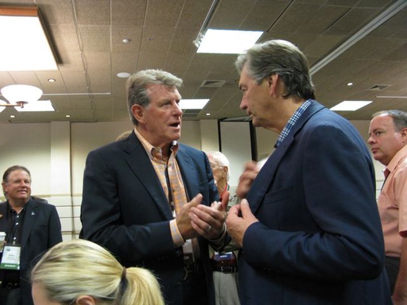 Idaho Gov. Butch Otter, left, buttonholes Canadian Ambassador Gary Doer on a water issue shortly before the start of the Western Governors Association conference in Coeur d'Alene on Wednesday. (Betsy Russell)