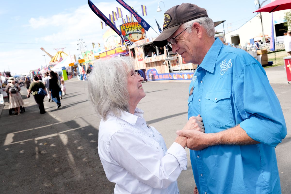 Tamy Wilkinson playfully punches her husband, Karl, in the chest as they flirt on Sept. 10 at the Spokane County Interstate Fair while reminiscing about their first date at the fair in 1966. The couple married in July 1970.  (Tyler Tjomsland/The Spokesman-Review)