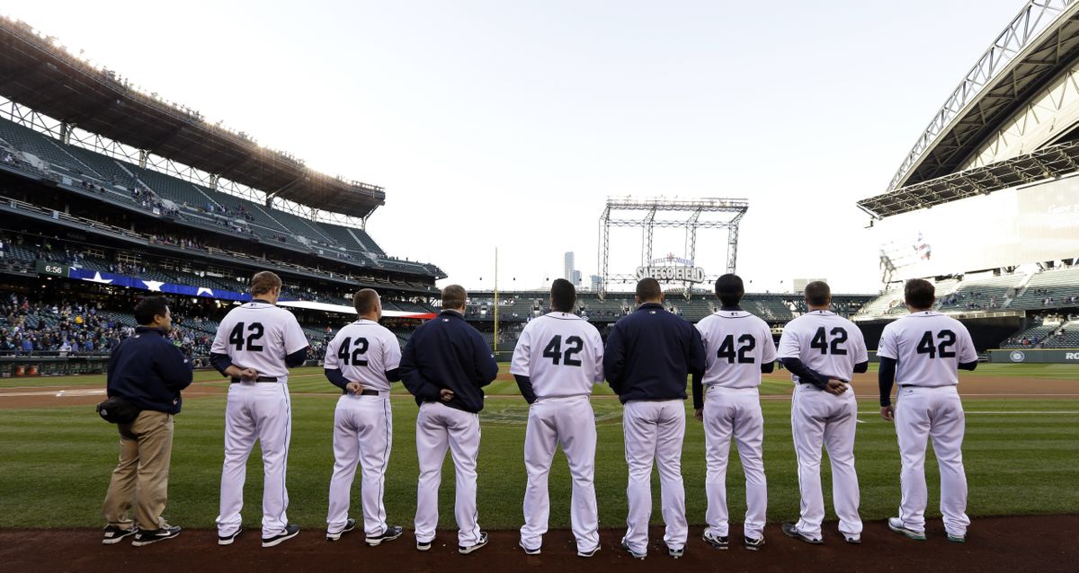 Seattle Mariners players line up for the national anthem all wearing No. 42 in honor of Jackie Robinson on Tuesday. (Associated Press)