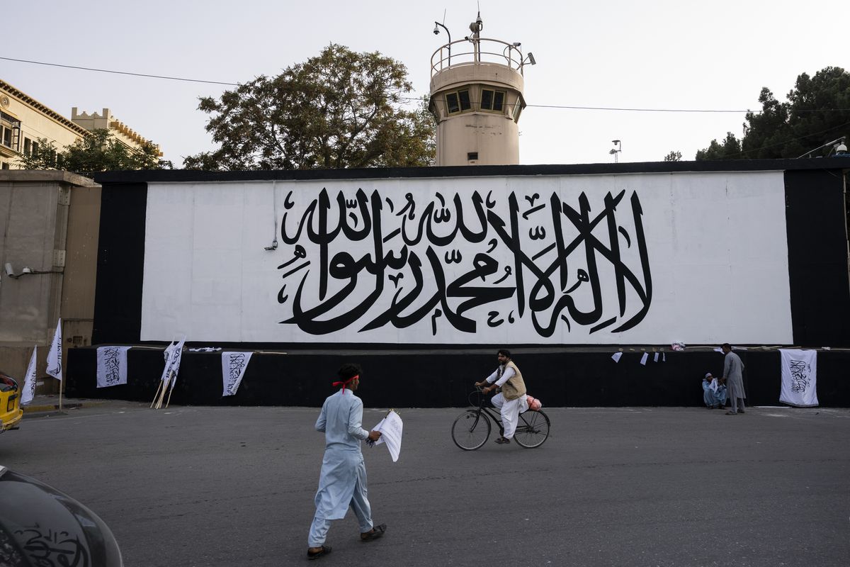 The iconic Taliban flag is painted on a wall outside the American embassy compound in Kabul, Afghanistan, Saturday, Sept. 11, 2021.  (Bernat Armangue)