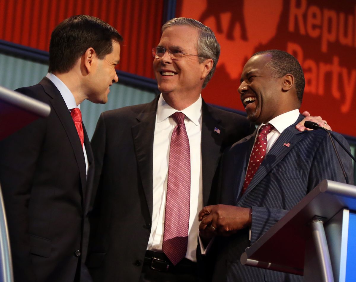 Republican presidential candidates from left, Marco Rubio, Jeb Bush and Ben Carson talk during a break during the first Republican presidential debate at the Quicken Loans Arena on Thursday in Cleveland. (Associated Press)