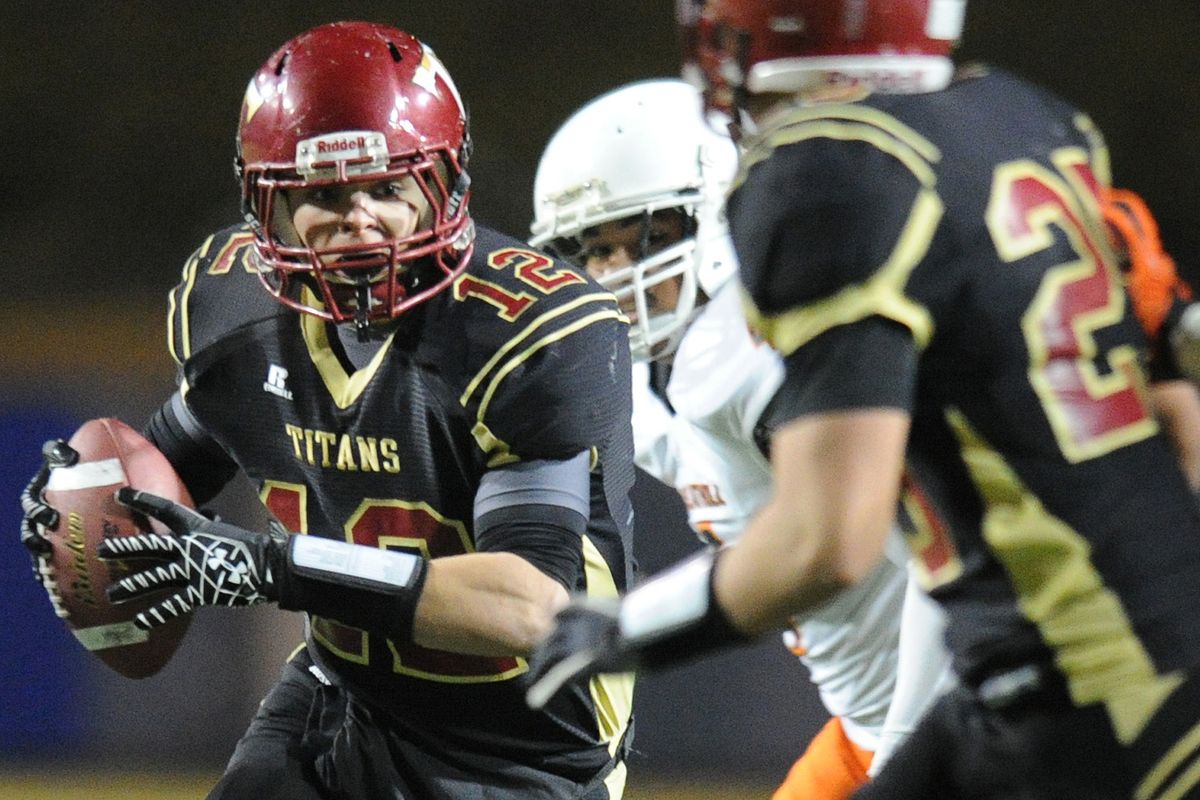 University High quarterback Jeff Beaty looks for an open receiver. (Tyler Tjomsland)