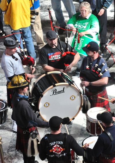 Members of the Pierce County Fire Fighters Pipes and Drums prepare to lead protesters through the halls of the Capitol on April 8, 2011. (Jim Camden/The Spokesman-Review)