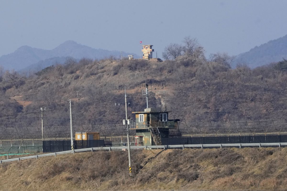 Military guard posts of North Korea, rear, and South Korea, front, are seen in Paju, near the border with North Korea, South Korea, Sunday, Jan. 2, 2022. South Korea