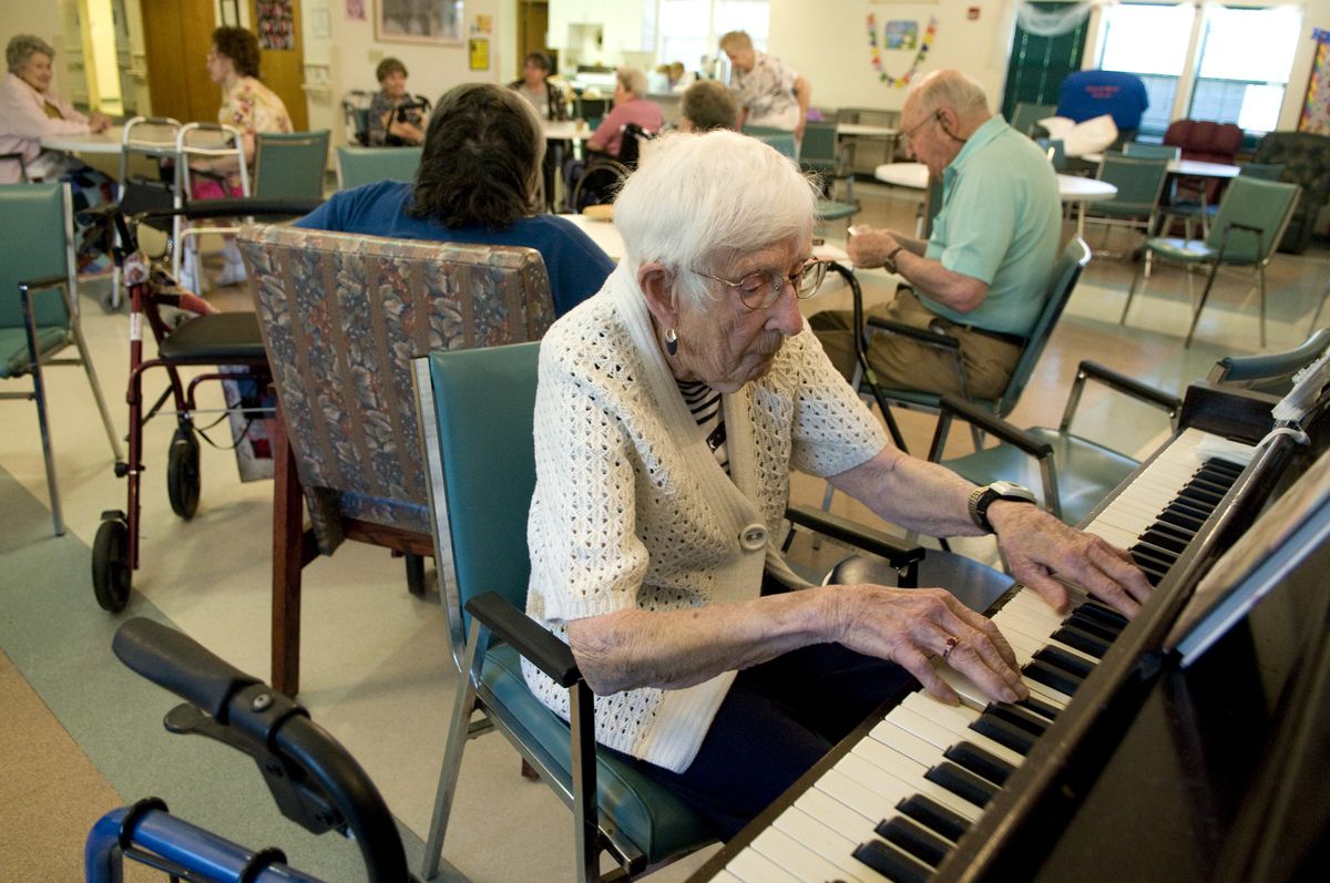 Eunice Brugh plays piano in the recreation room Wednesday at the Providence Adult Day Health center at 6018 N. Astor St. on Spokane’s North Side. colinm@spokesman.com (COLIN MULVANY colinm@spokesman.com / The Spokesman-Review)