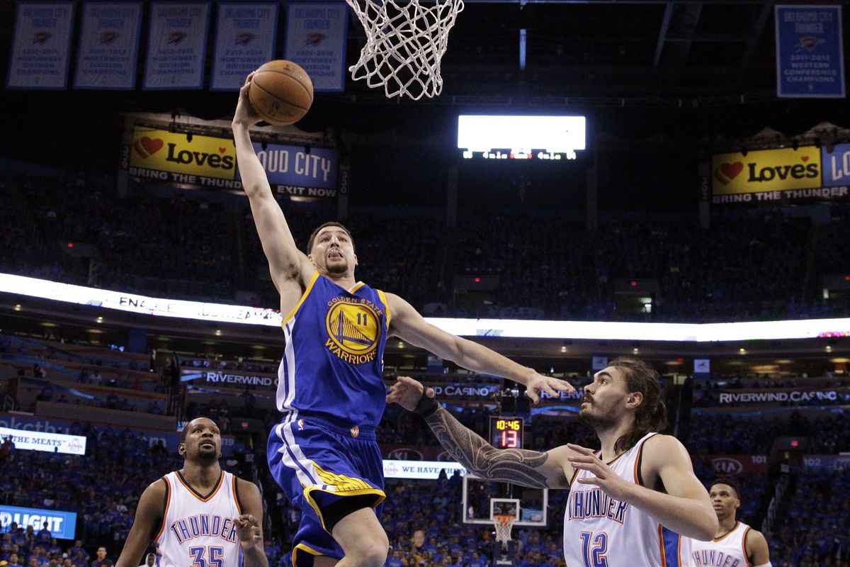 Golden State Warriors guard Klay Thompson (11) shoots over Oklahoma City Thunder center Steven Adams (12) during the second half in Game 6 of the NBA basketball Western Conference finals in Oklahoma City, Saturday, May 28, 2016. The Warriors won 108-101.   (Sue Ogrocki)