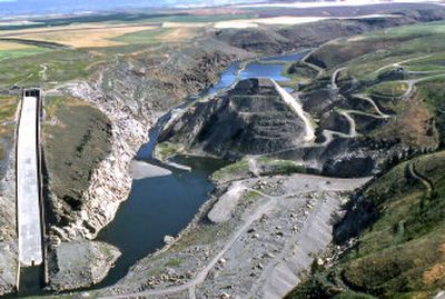 
This 2002 image  shows an upstream view of remnants of the Teton Dam. When the brand-new Teton Dam gave way on June 5, 1976, 80 billion gallons of water surged down the valley of eastern Idaho farming towns. The structure at left was the dam's spillway. 
 (Associated Press / The Spokesman-Review)