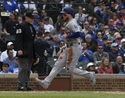 Los Angeles Dodgers' Alex Verdugo (27) scores against the Chicago Cubs during the fifth inning on Thursday. The Dodgers won 2-1. (David Banks / Associated Press)