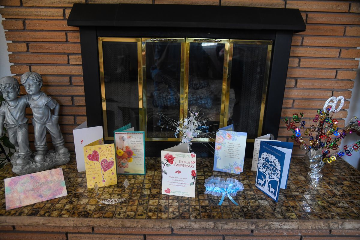 Dick and Dody Dodd display cards and other items honoring their 60th wedding anniversary on their fireplace. (Dan Pelle / The Spokesman-Review)