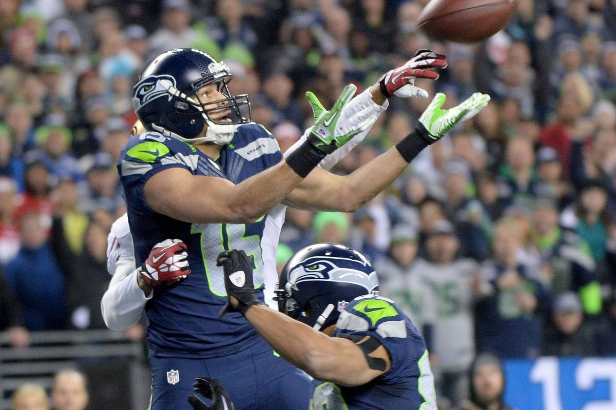 Seahawks receiver Jermaine Kearse leaps to catch the football before tumbling to the turf with the go-ahead touchdown in the final quarter of the NFC championship game. (Joe Barrentine)
